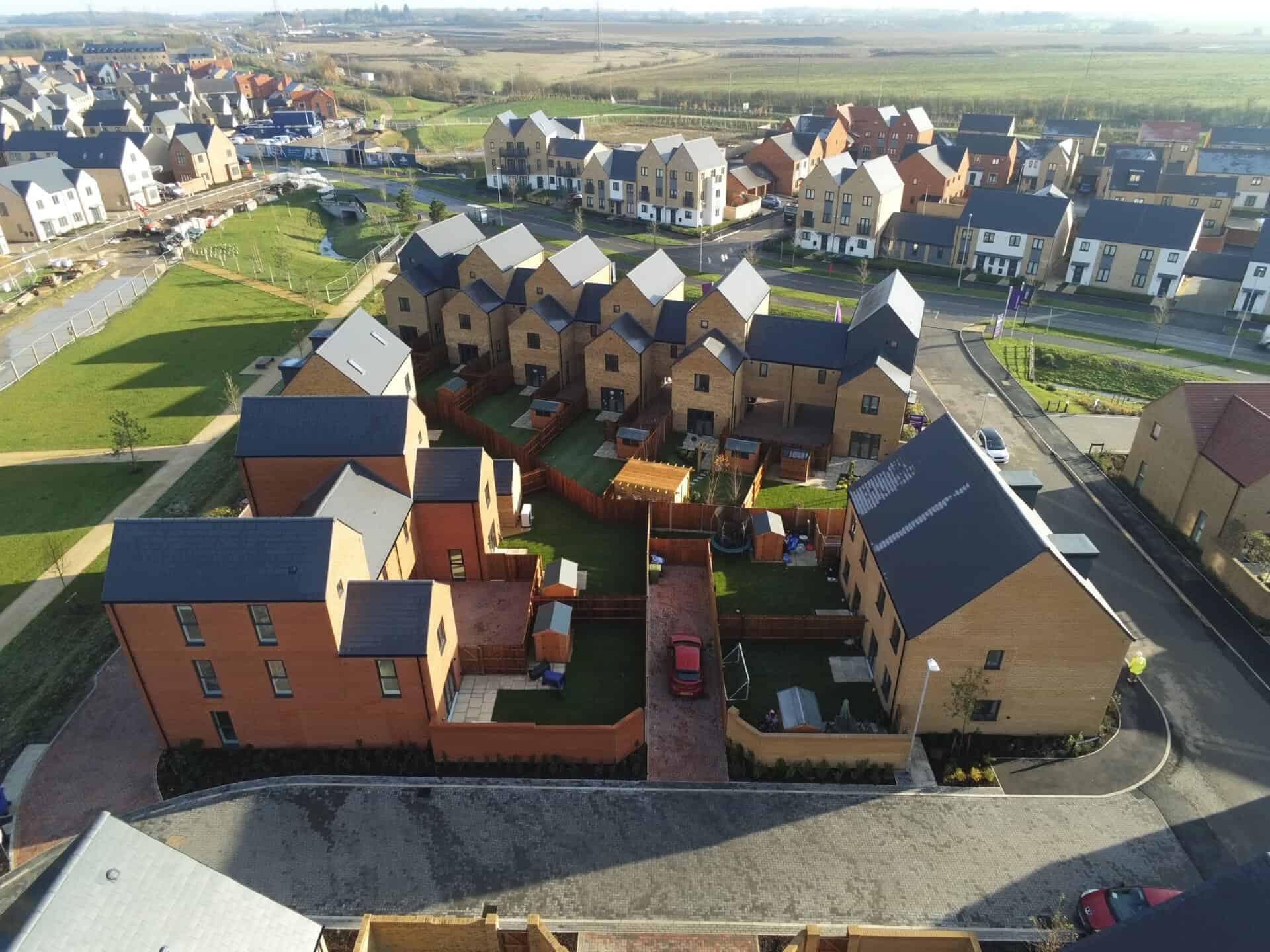 Aerial view of a street of new build homes at Wintringham